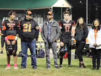 Senior football players with parents