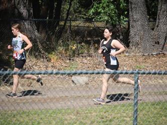 Cross country girls running during the race