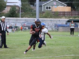 football player running with the ball