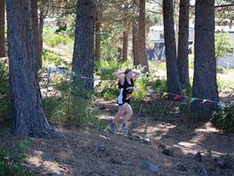 Cross country girl running in the woods