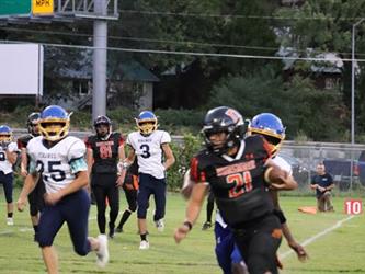 football player running with the ball