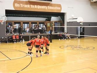 Volleyball players huddling