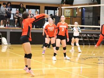 Varsity Volleyball bumping the ball