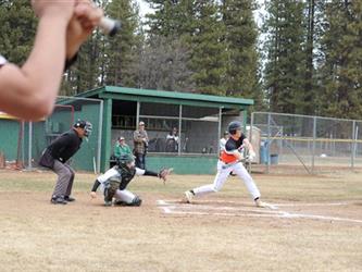 player swinging on home base 