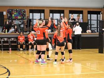 Varsity Volleyball team huddle