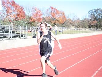 student running on a track