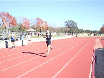 student running on a track