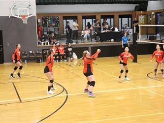 Volleyball players waiting to hit the ball