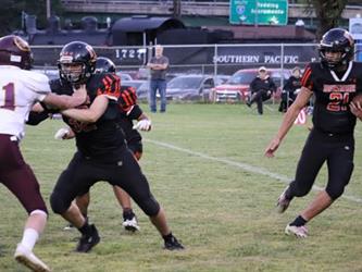 blocking and running with football