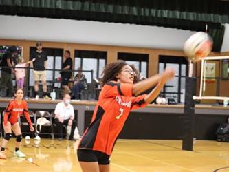 Varsity Volleyball returning the ball