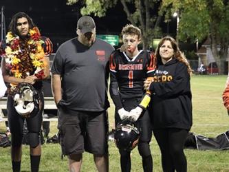 Senior football players with parents