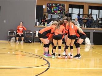 Varsity Volleyball team huddle