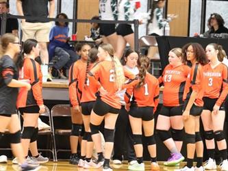 Varsity Volleyball group huddle