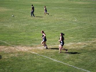 Cross country girls running on the field