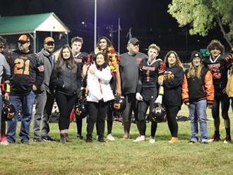 Senior football players with parents