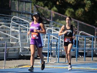 Cross country girls running on the track