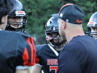 football coach talking to players