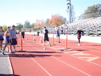 student running on a track