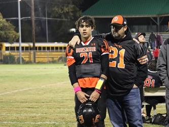 Senior football players with parents