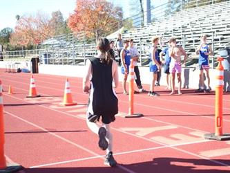 student running on a track