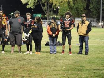 Senior football players with parents