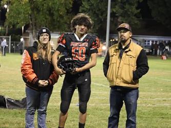 Senior football players with parents