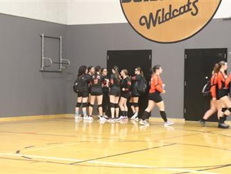 Junior varsity volleyball team huddle