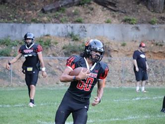 football player running with the ball