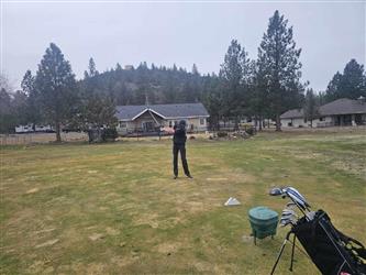 swinging golf club