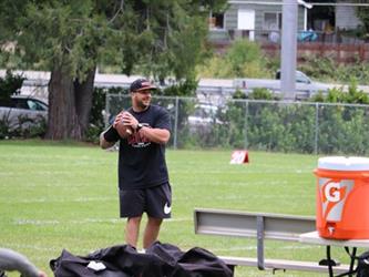 coach throwing football