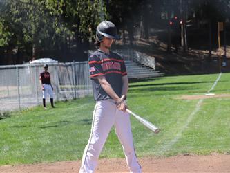 baseball player swinging bat