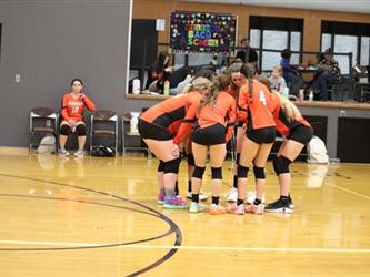 Varsity Volleyball team huddle
