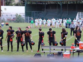 football players on sidelines