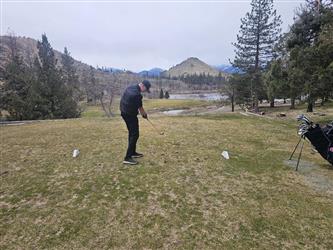 swinging golf club
