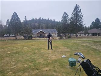 swinging golf club