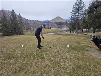 swinging golf club
