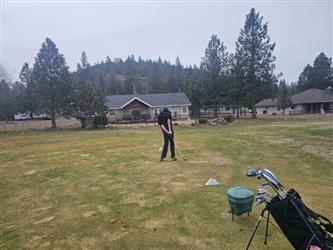 swinging golf club