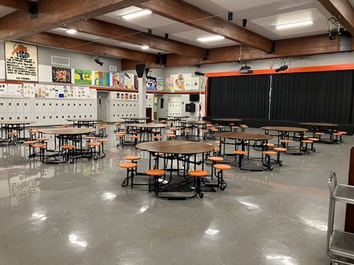 auditorium showing cafeteria tables