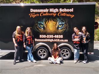 students in front of culinary trailer